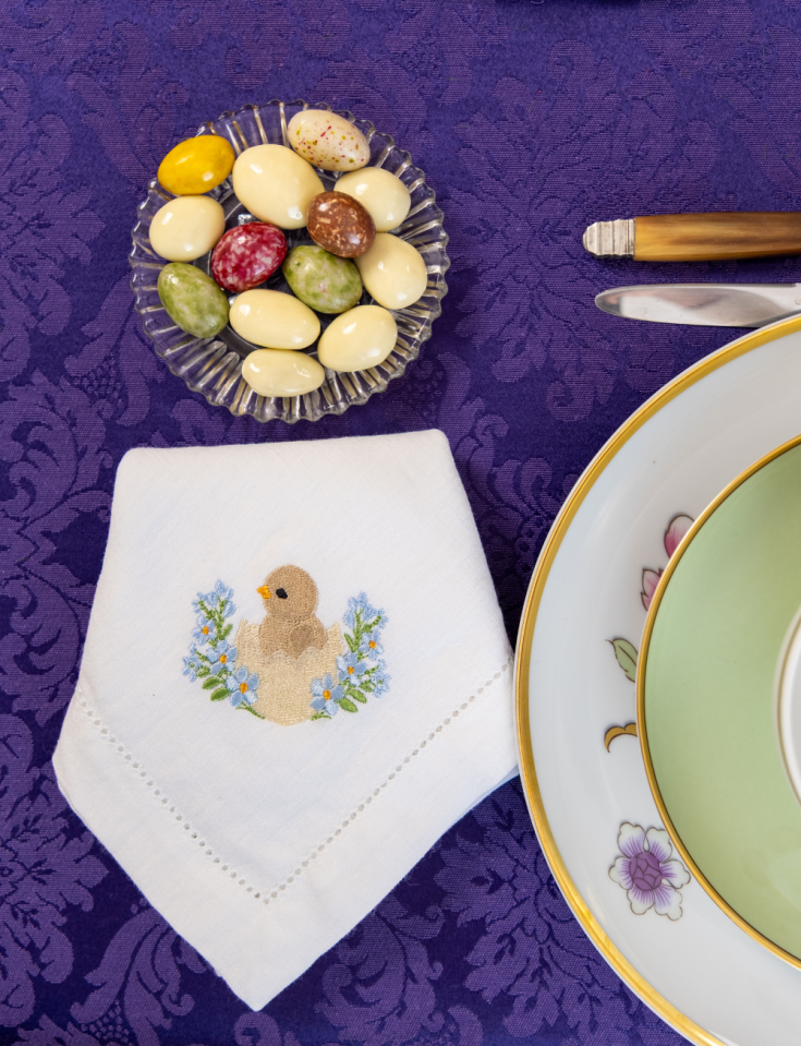 Easter napkin, machine-embroidered with an open hem.