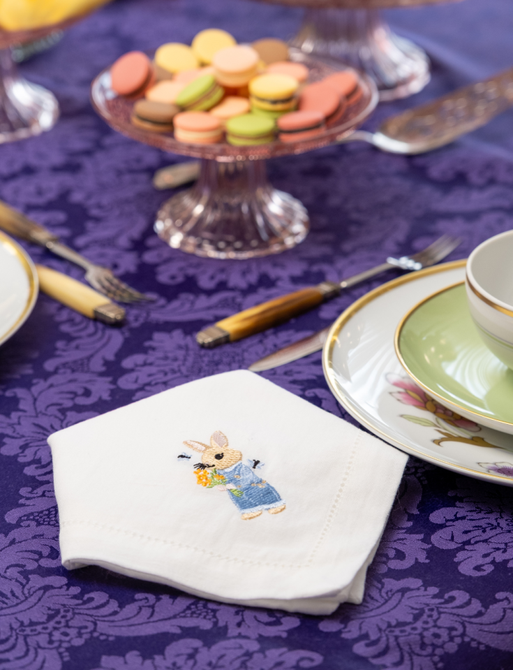 Easter napkin, machine-embroidered with an open hem.